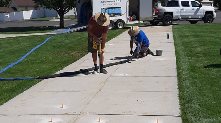 Poly-Lift crew lifting a residential driveway with Deep Foamjection