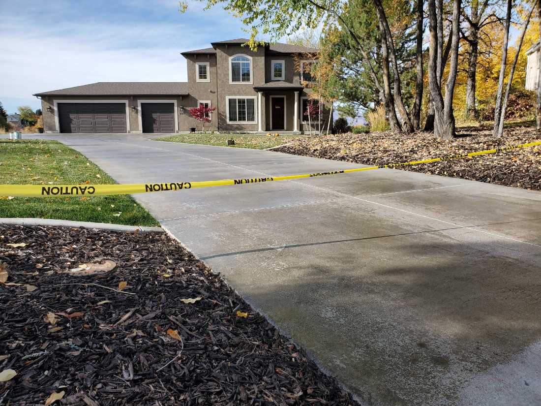 Wet Concrete Sealant Applied To Blocked Driveway