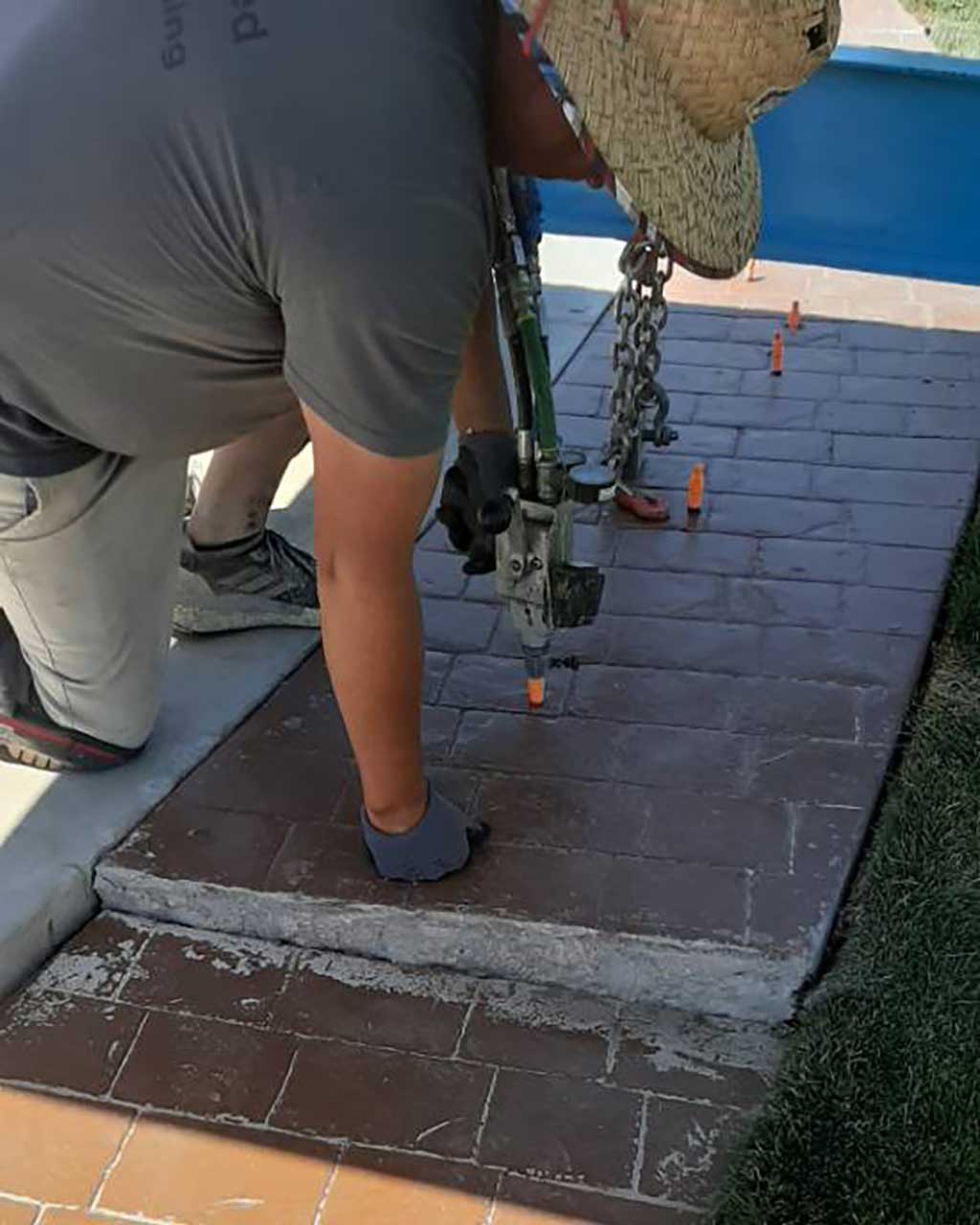 Poly Lift Crewman Injecting Deepfoam Into Concrete Walkway